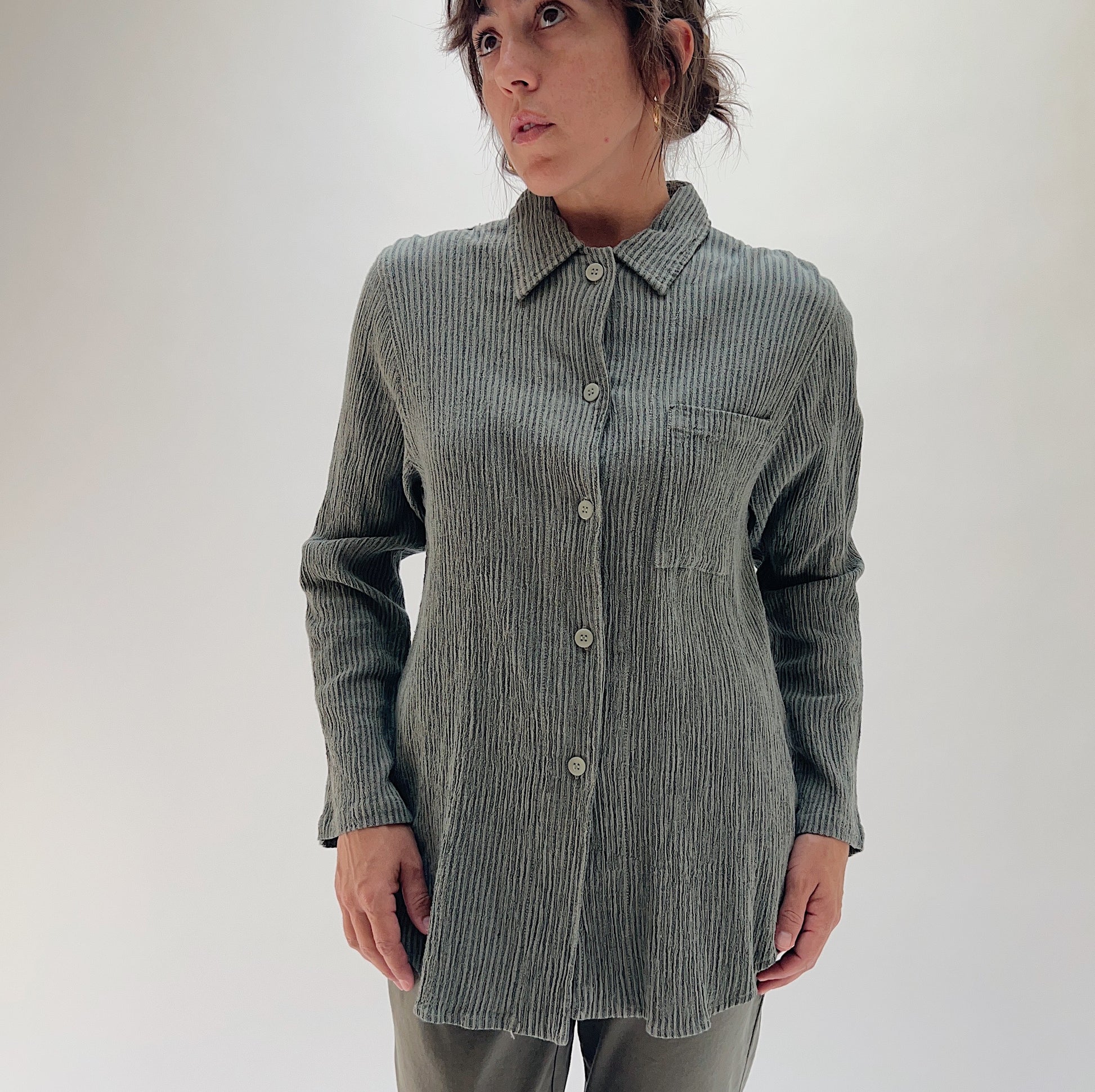 Full front view of model wearing Mill Valley Clothing Co olive boyfriend button-down, showing long sleeves, button placket, and tunic-length hem