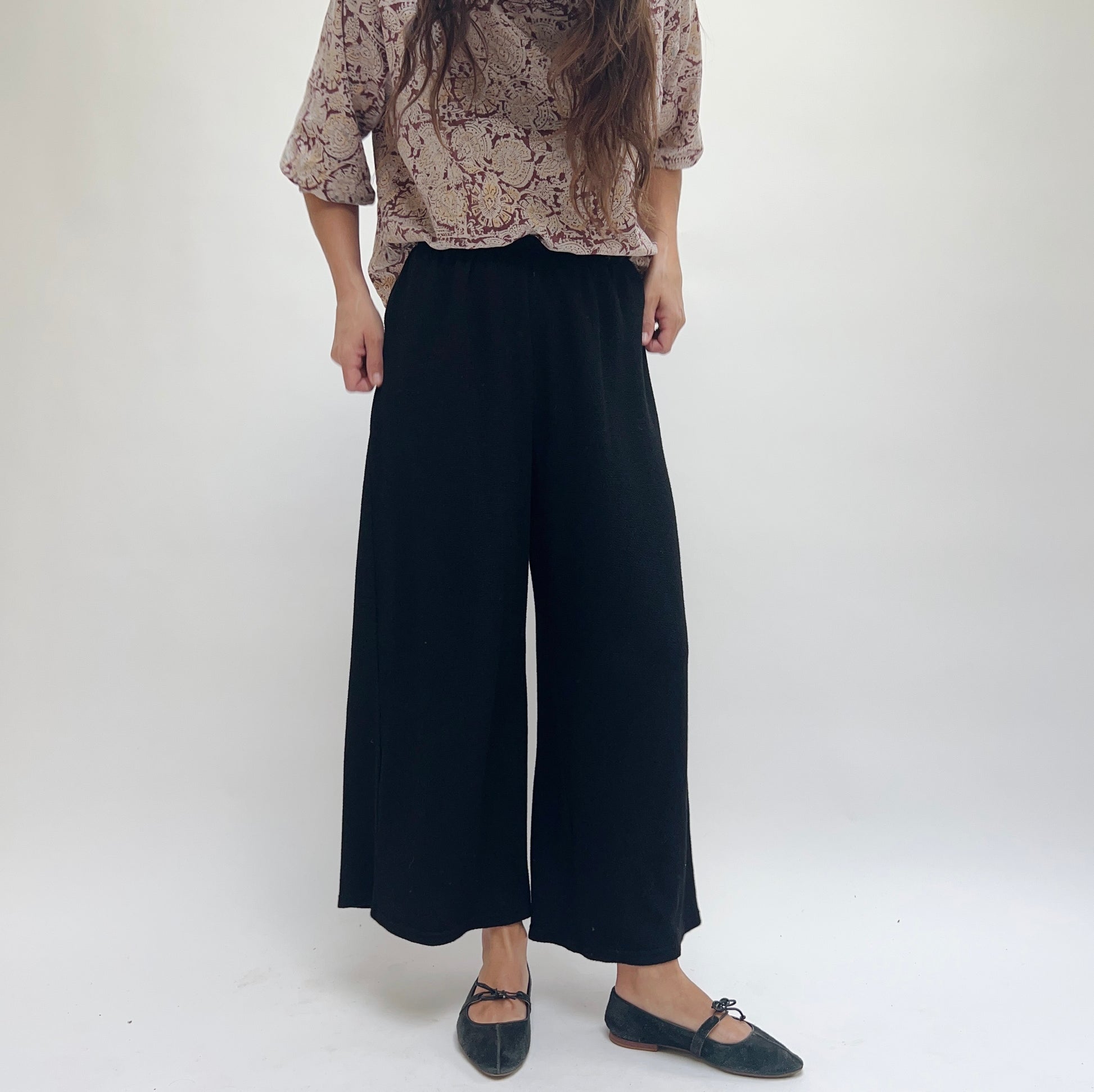 Cut Loose Marled Knit Crop Pant in Black, three-quarter front view highlighting relaxed wide-leg fit and soft knit fabric texture
