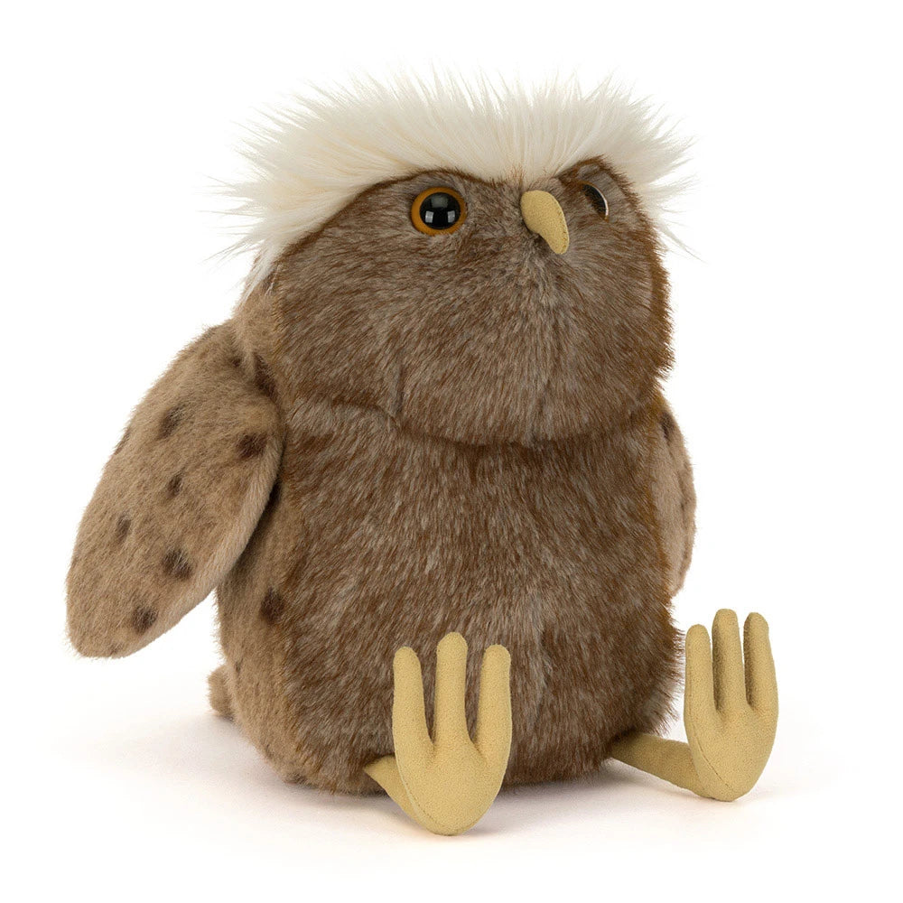 Jellycat Tawoola Owl, angled front view showing brown plush, spotted wings, a fluffy cream crown, and yellow beak and feet.
