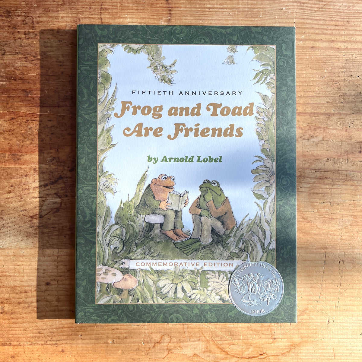 Cover of Frog and Toad Are Friends, 50th anniversary edition by Arnold Lobel, showing the friends reading together.
