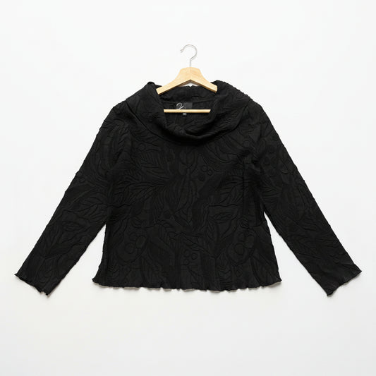 Black textured blouse on a hanger against a white background