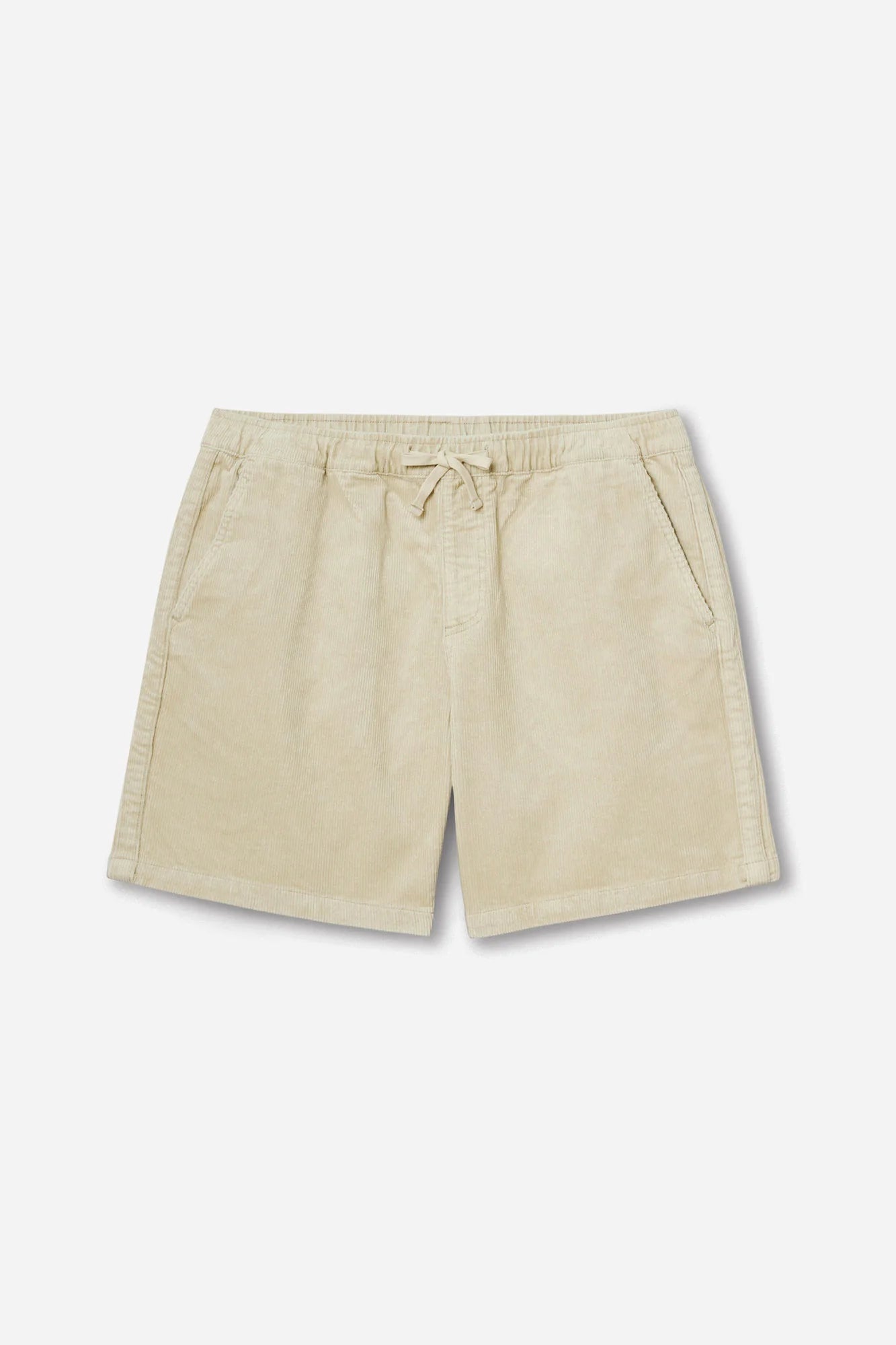 Katin Kord Patio Shorts in Pelican — flat lay front view showing the elastic waistband with external drawcord, faux fly, front slash pockets, and relaxed 18" outseam in pale cream stretch corduroy, on a light grey background
