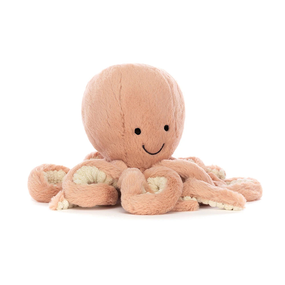 Jellycat Little Odell Octopus, angled front view showing peach-pink plush, embroidered eyes, a stitched smile, and curled arms.
