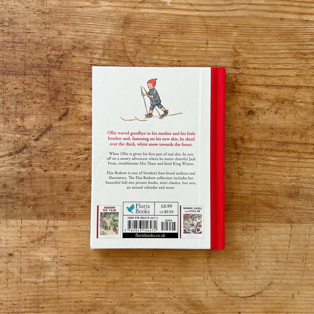 Back cover with red fabric binding of Elsa Beskow's Ollie's Ski Trip