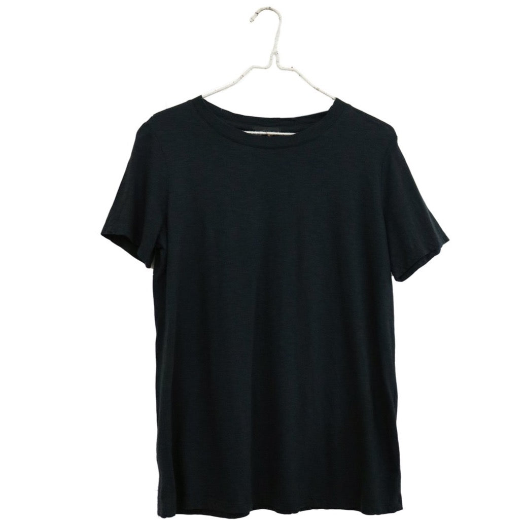 It Is Well Everyday Crewneck Tee in Black, flat hanger shot on white background showing solid black lightweight slub jersey, clean crew neck, short sleeves, and relaxed full-length silhouette
