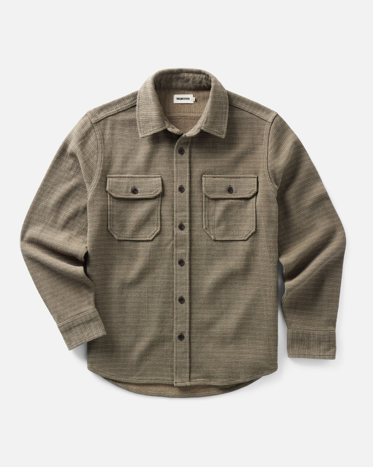 Front view of Taylor Stitch’s Division Shirt in Cypress, showing long sleeves, button front, two flap chest pockets, and curved hem.
