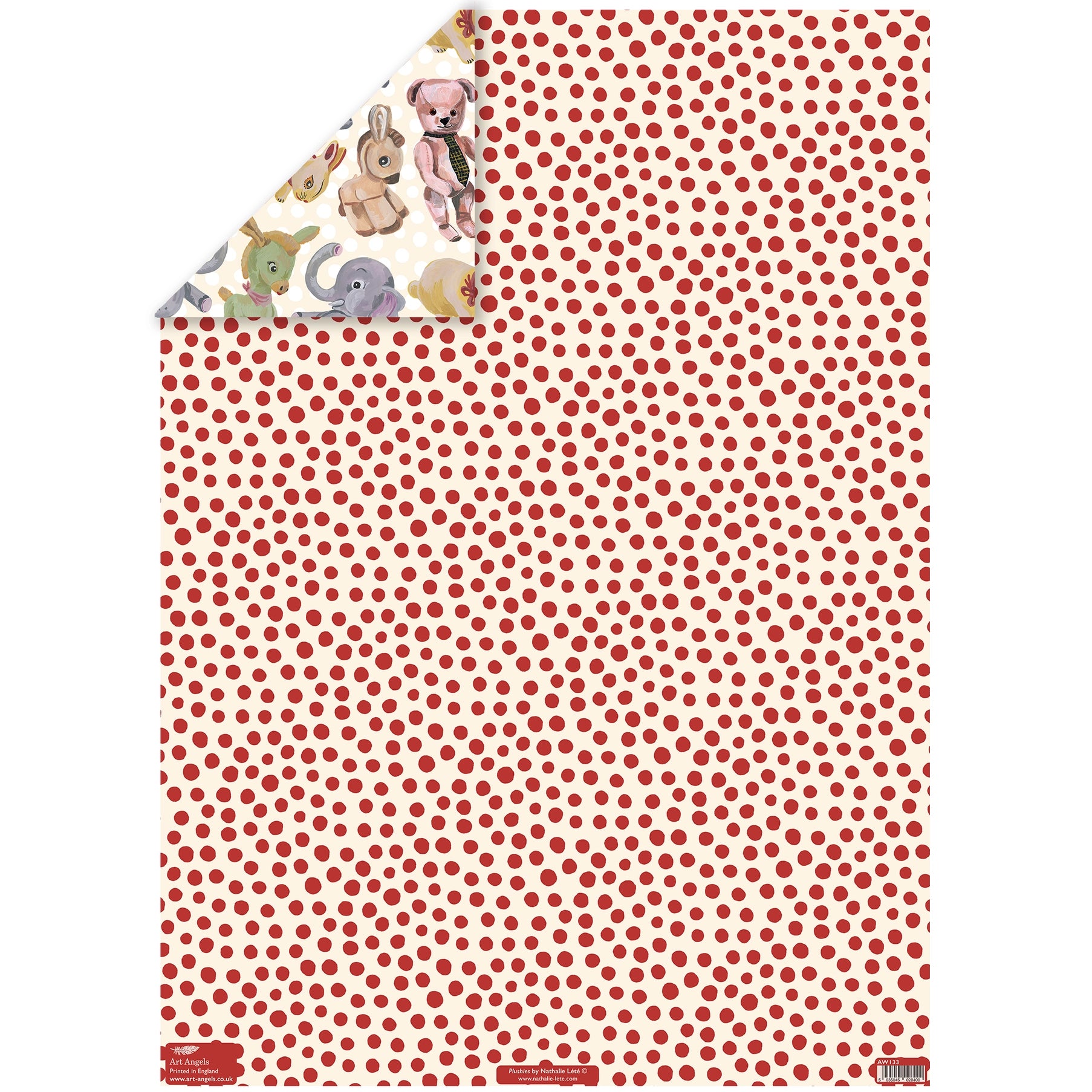 Reverse side of Plushies wrapping paper by Nathalie Lété showing a cream background covered in scattered red polka dots, with a corner folded back to reveal the plush animal print front, printed by Art Angels in England