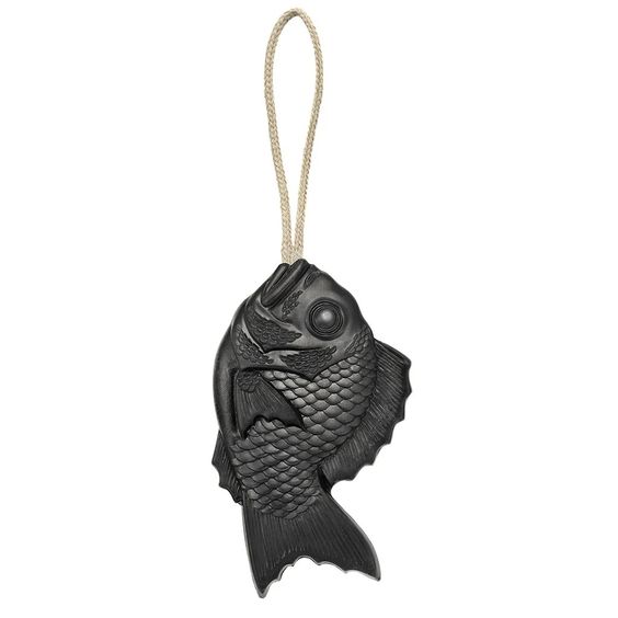 Tamanohada Muscovado Welcome Soap — deep charcoal bream fish-shaped soap with detailed scale texture, hanging from a natural braided linen rope on a white background

