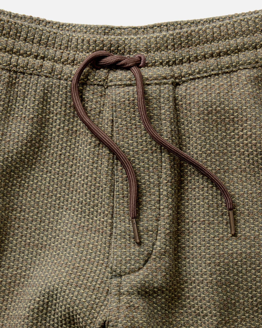Detail shot of the Taylor Stitch Après Ski Pant drawcord waistband and sashiko texture in olive cypress
