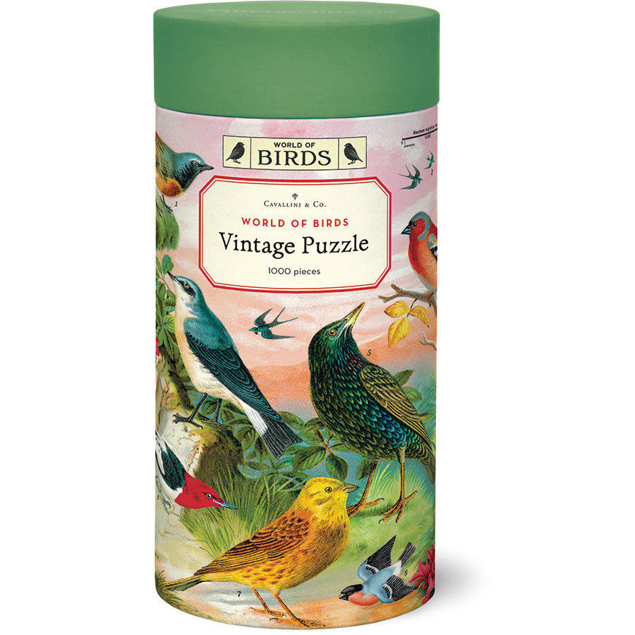 Front of the Cavallini & Co. World of Birds Vintage Puzzle tube with a green lid, wrapped in colorful vintage bird illustrations.
