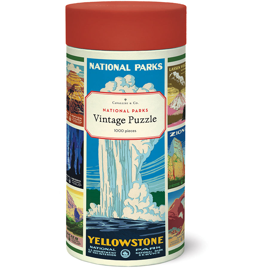 Front of the Cavallini & Co. National Parks Vintage Puzzle tube with a red lid, wrapped in vintage national park poster artwork with a Yellowstone poster at center.
