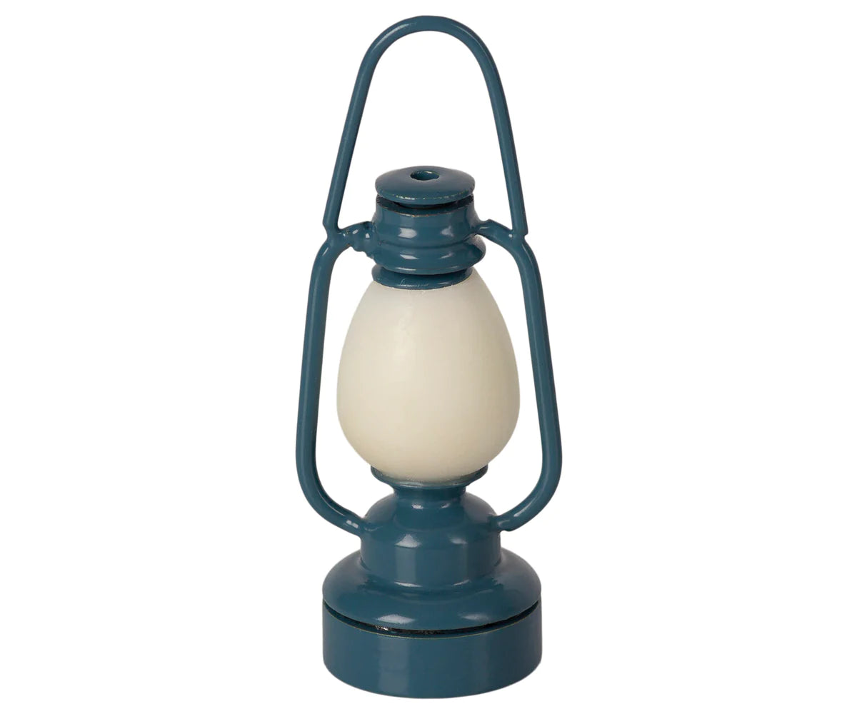 Maileg Vintage Lantern in Blue — a miniature mouse-sized working lantern in muted blue-grey with a cream globe, arched carry handle, and twist-open base, on a white background
