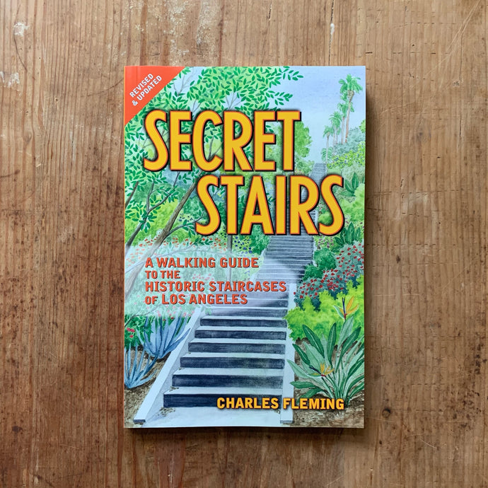secret stairs cover shot laydown top view on wooden background