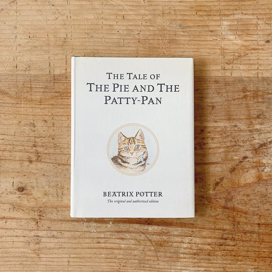 Hardcover book titled 'The Tale of the Pie and the Patty-Pan' by Beatrix Potter, featuring an illustration of a cat on the cover.