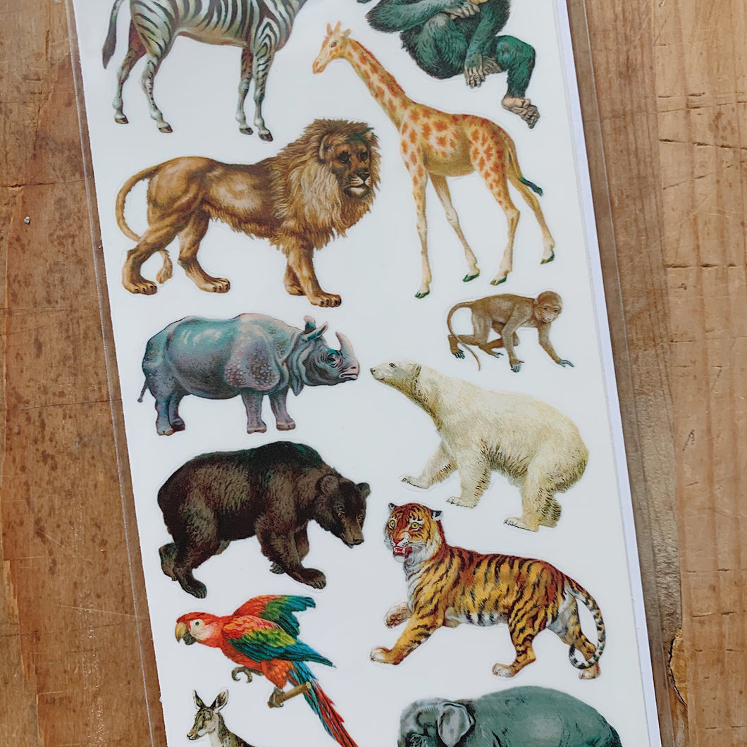 Overhead close up view of realistic wild animals including giraffes, tigers and bears.