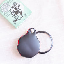 Load image into Gallery viewer, flat lay of pocket magnifying glass toy
