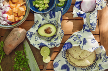 Load image into Gallery viewer, bee&#39;s wrap assorted 3 pack in situ with food on tabletop background bees and bears
