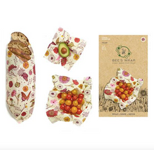 Load image into Gallery viewer, bee&#39;s wrap 3 pack meadow magic laydown on white background with food and packaging
