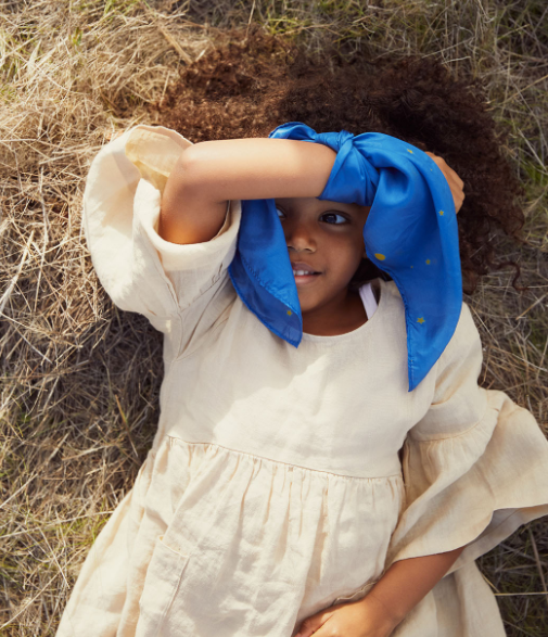 enchanted mini playsilk starry sky seen outside with model wearing on her wrist