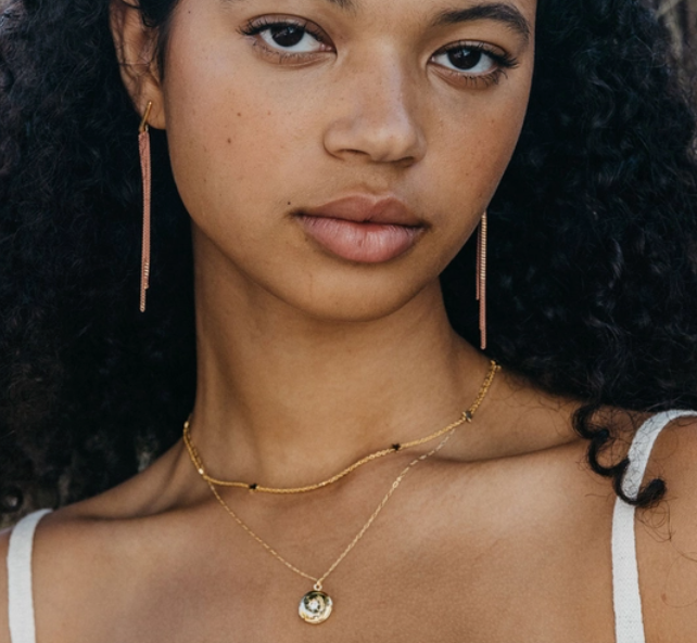 amano studio small round locket necklace front view on model